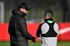 Jürgen Klopp and Thiago Alcântara in conversation during a Liverpool training session.
