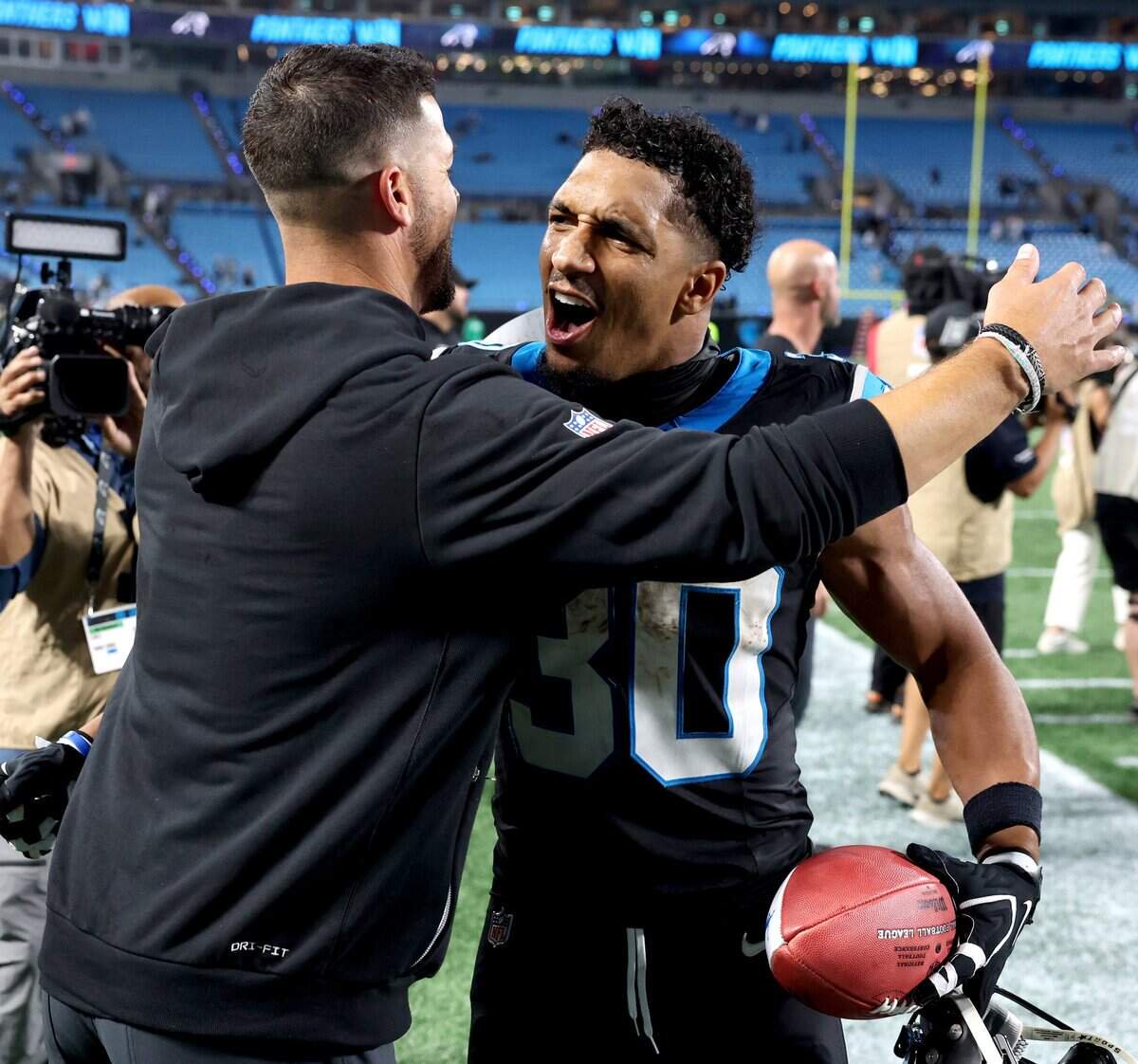 Carolina Panthers head coach Dave Canales, left, congratulates running back Chuba Hubbard, right, on his performance during action against the Detroit Lions at Bank of America Stadium in Charlotte, NC on Sunday, October 4, 2026. The Panthers defeated the Lions 32-26.
