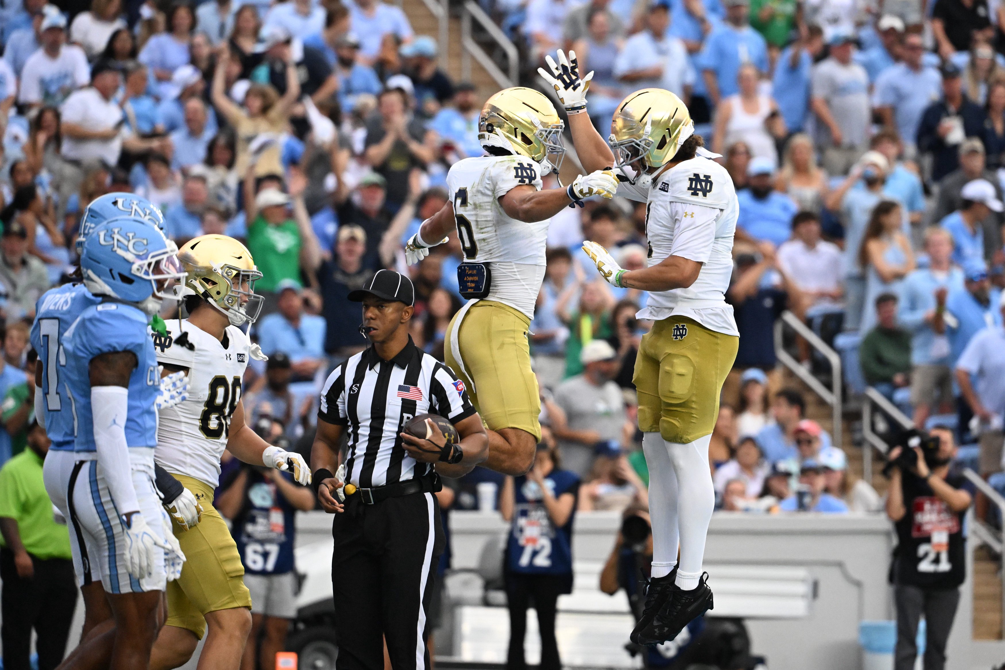 Oct 3, 2026; Chapel Hill, North Carolina, USA;  Notre Dame Fighting Irish wide receiver Jordan Faison (6) celebrates with wide receiver Jaden Greathouse (1) after making a touchdown catch in the first quaret at Kenan Stadium. Mandatory Credit: Bob Donnan-Imagn Images