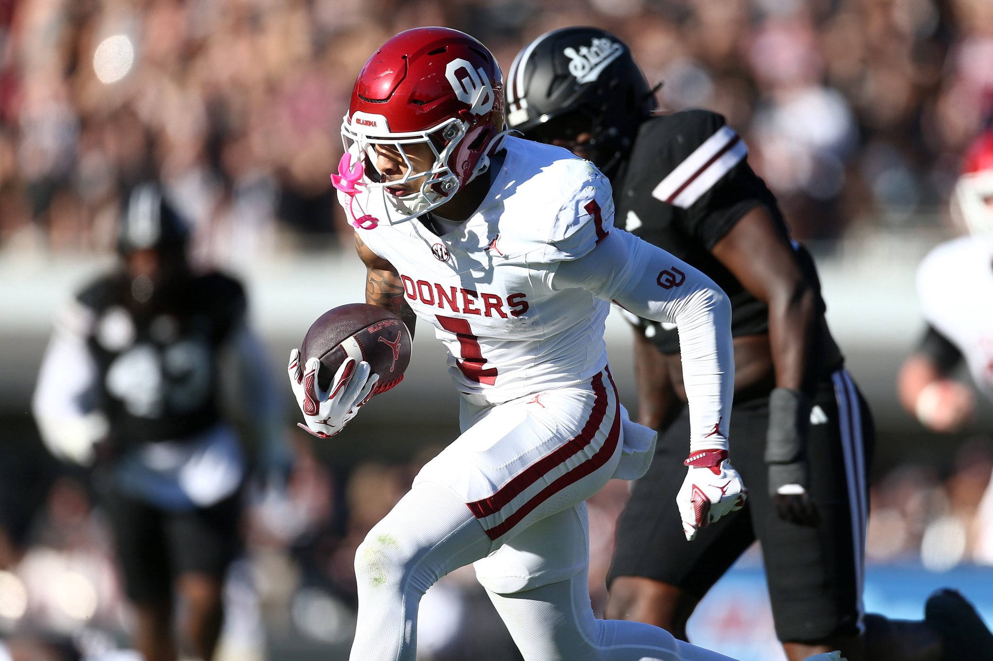 Oct 24, 2026; Starkville, Mississippi, USA;  Oklahoma Sooners wide receiver Isaiah Sategna III (1) runs after a catch for a touchdown during the second quarter against the Mississippi State Bulldogs at Davis Wade Stadium at Scott Field.  Mandatory Credit: Petre Thomas-Imagn Images