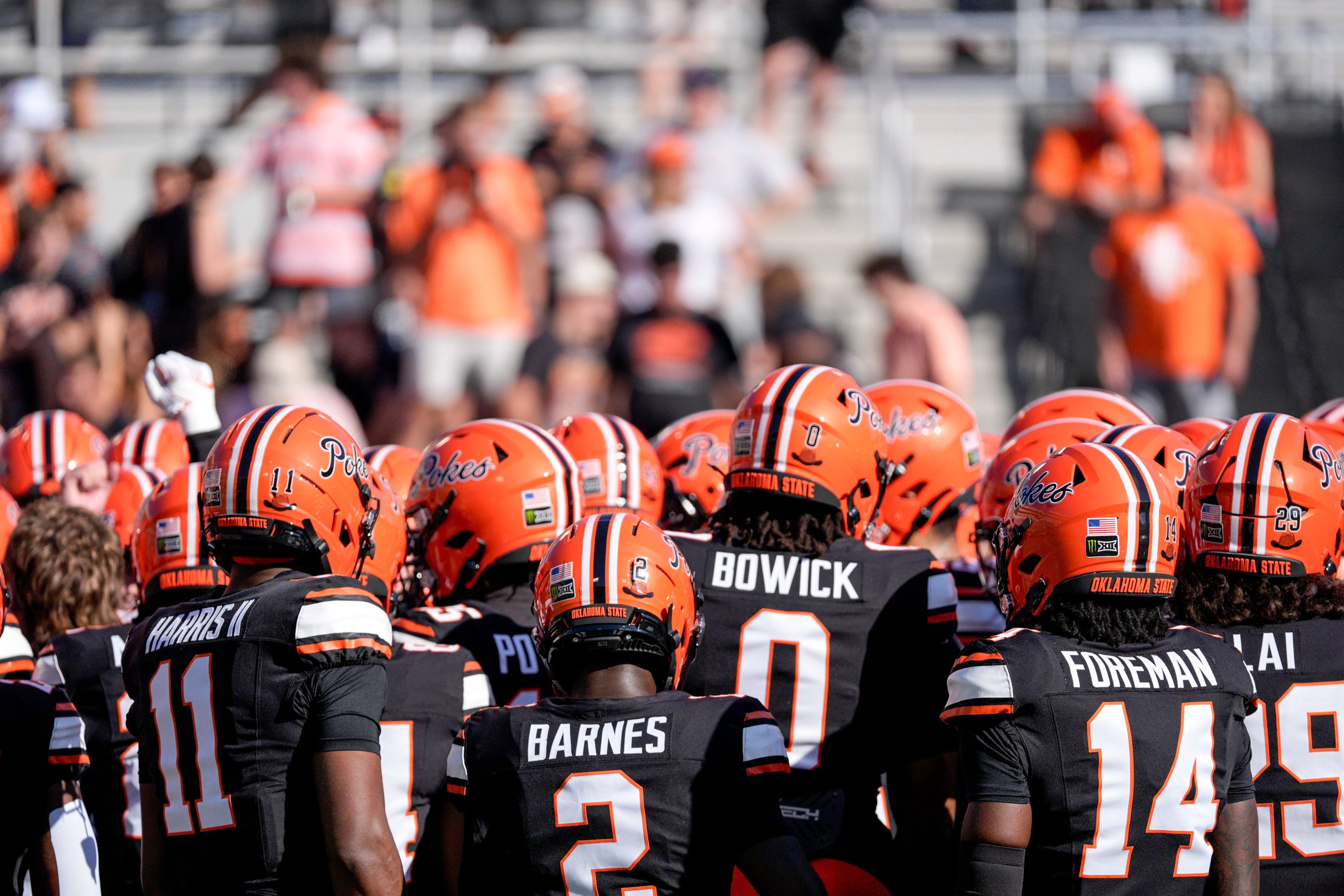 OSU players huddle up before an NCAA football game between the Oklahoma State University (OSU) Cowboys and the University of Central Florida (UCF) Knights at Boone Pickens Stadium in Stillwater, Okla., on Saturday, Oct. 10, 2026.