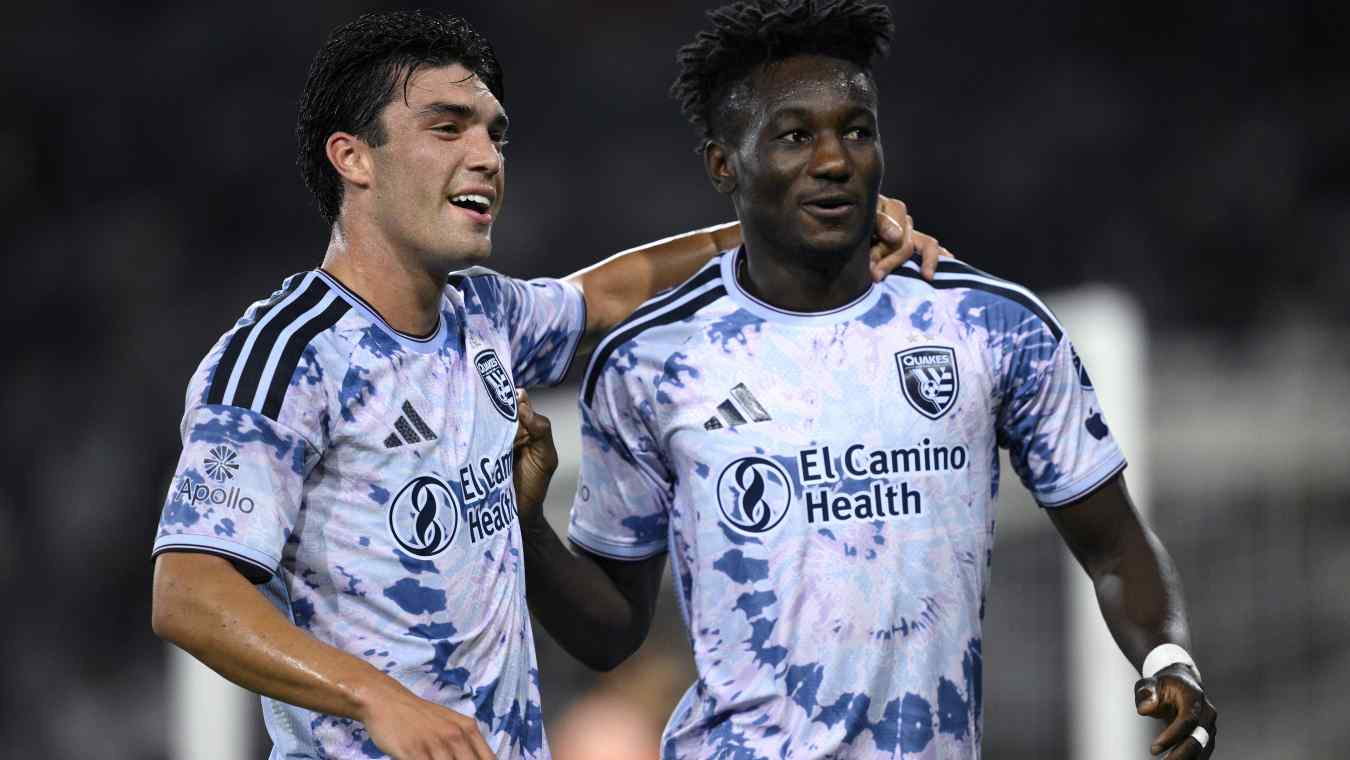 Ousseni Bouda and Niko Tsakiris celebrate a goal.