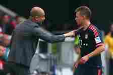 Josep Guardiola, head coach of Muenchen talks to his player Joshua Kimmich during the Bundesliga match between VfB Stuttgart and FC Bayern Muenchen...
