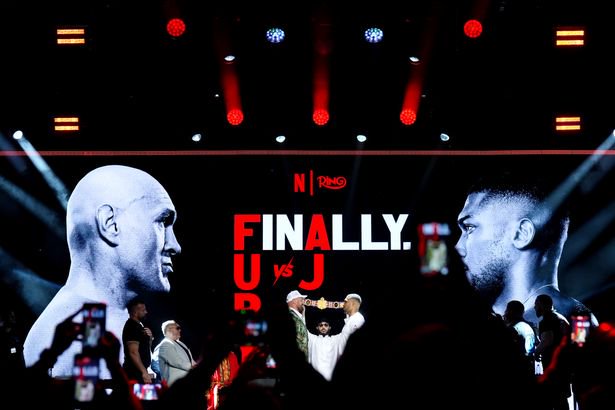 Tyson Fury (left) and Anthony Joshua face off following a press conference at British Airways ARC at the Olympia, London.