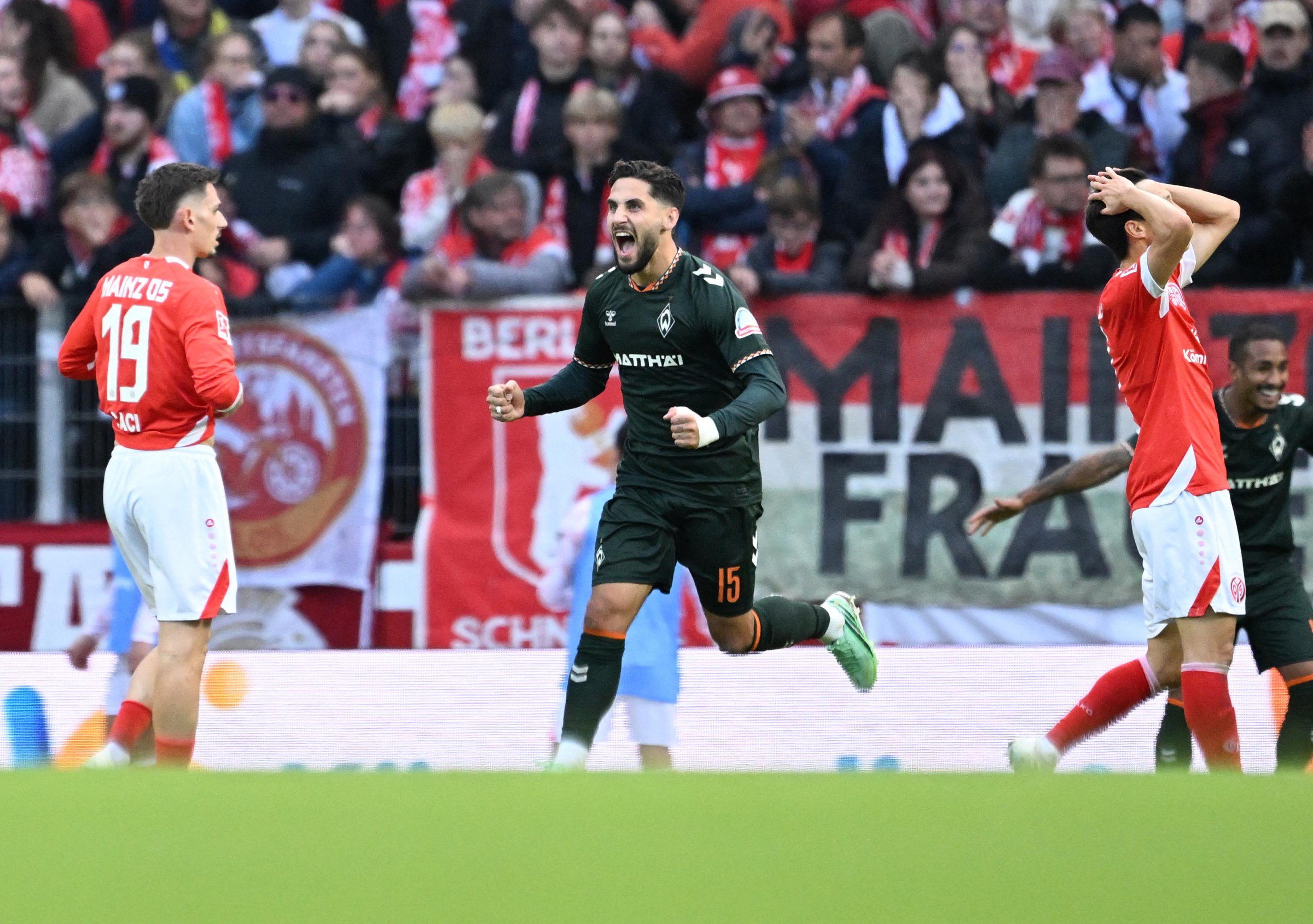 Bremen’s Dutsch midfielder #15 Ludovit Reis (C) celebrates scoring during the German first division Bundesliga football match between Mainz 05 and Werder Bremen in Mainz on October 24, 2026. (Photo by Kirill KUDRYAVTSEV / AFP via Getty Images) / DFL REGULATIONS PROHIBIT ANY USE OF PHOTOGRAPHS AS IMAGE SEQUENCES AND/OR QUASI-VIDEO
