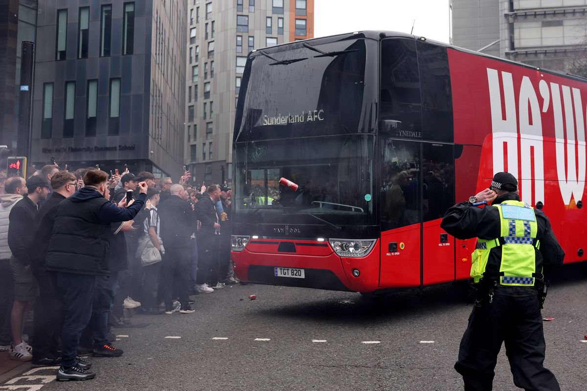 The Sunderland team bus drives through a crowd of Newcastle United fans
