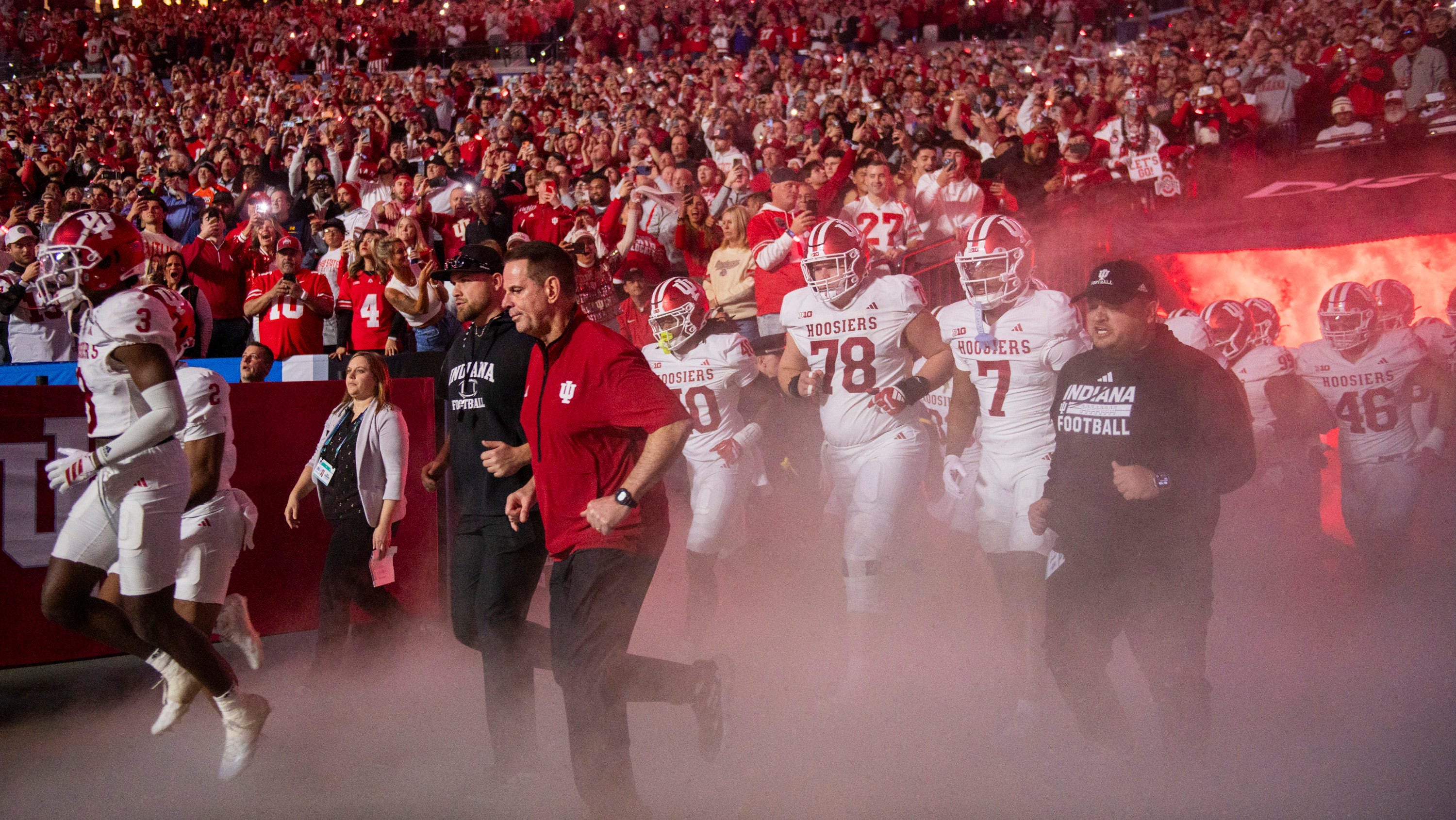 Indiana Head Coach Curt Cignetti leads the team to the field before the BIg Ten Championship football game at Lucas Oil Stadium on Saturday, Dec. 6, 2025.