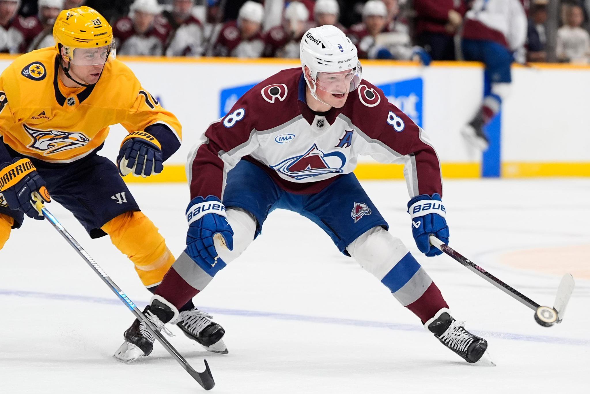 Colorado Avalanche defenseman Cale Makar (8) skates the puck past Nashville Predators center Jack Drury (18) during the first period of an NHL hockey game Monday, Oct. 26, 2026, in Nashville, Tenn.