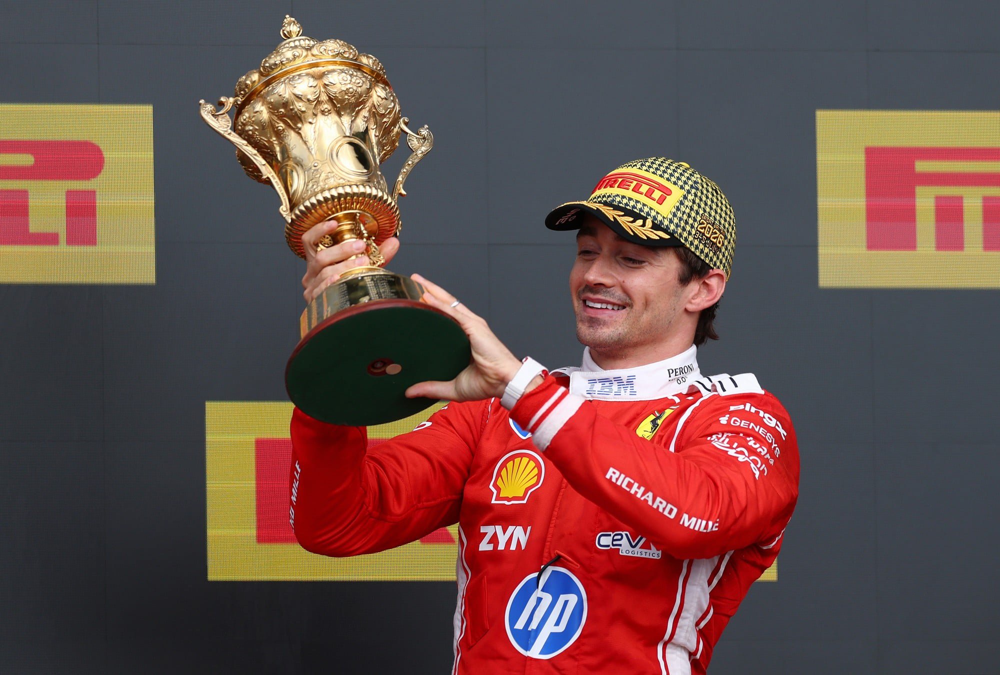 Charles Leclerc holds his trophy after winning British Grand Prix at Silverstone