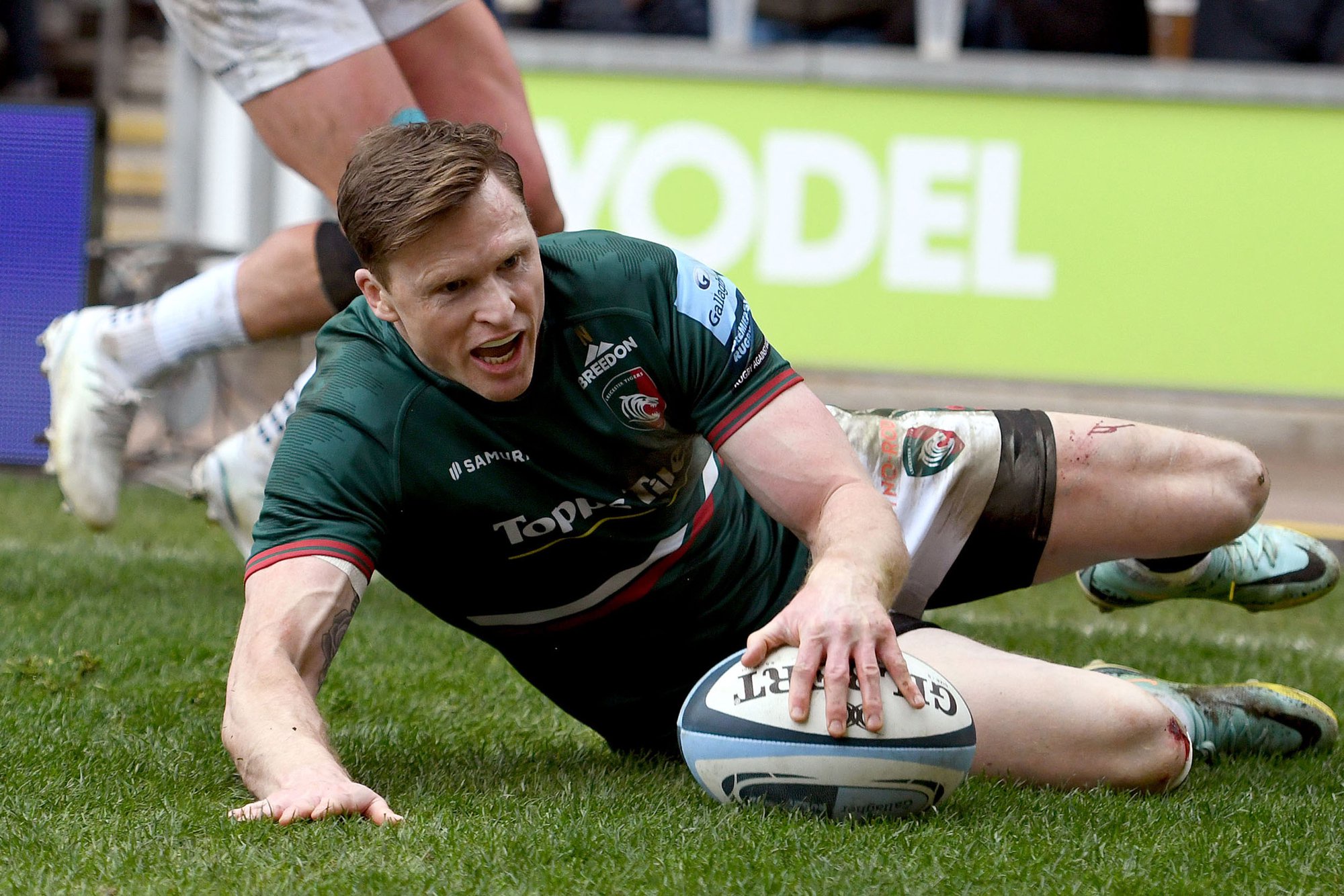 Chris Ashton of Leicester Tigers scores a try to break the Premiership try-scoring record during a Gallagher Premiership Rugby match against Exeter Chiefs in April 2023.