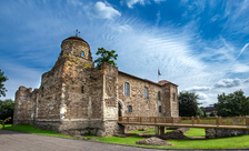 Essex castles: the exterior of Colchester Castle, with a wooden footbridge to the entrance