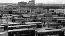 Getty Images Black and white photo of Cardiff's former bus station. It shows buses lined up in the bays in the station