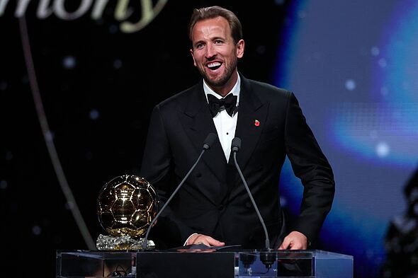 England and Bayern Munich forward Harry Kane reacts after receiving the Ballon d'Or award for the best male footballer