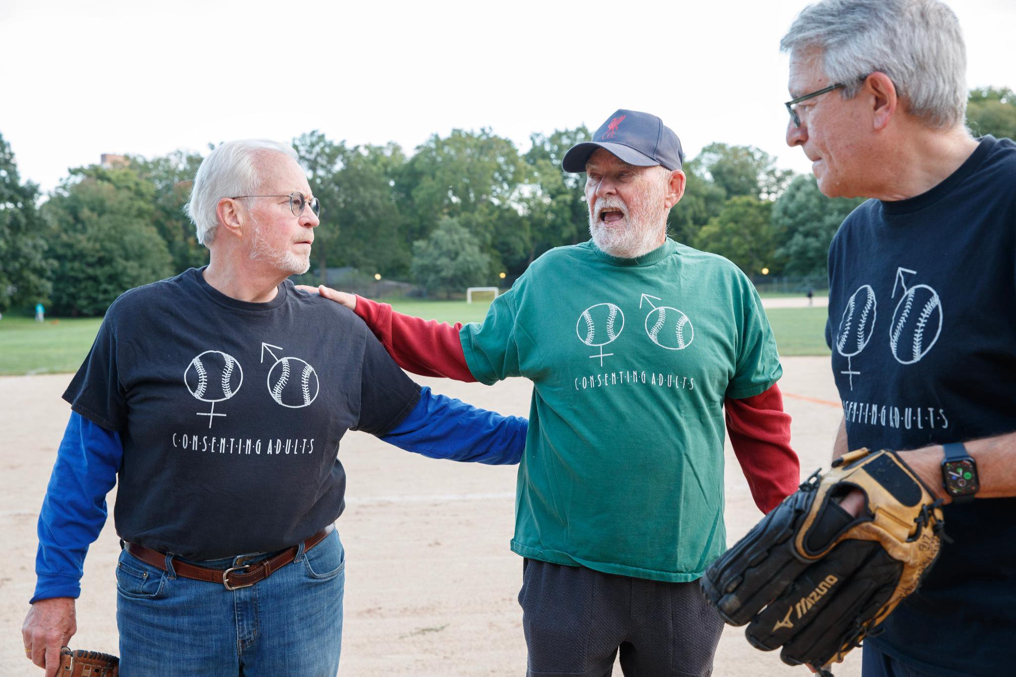 Eddie Campbell, commissioner of the Consenting Adults softball team, in a green shirt, greets his teammates at Central Park in New York, Wednesday, Sept. 23, 2026.