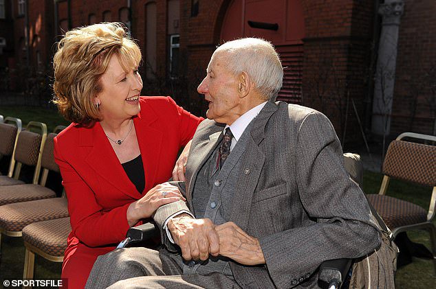 President of Ireland Mary McAleese chats Peter 'The Man In The Cap' McDermott in 2010