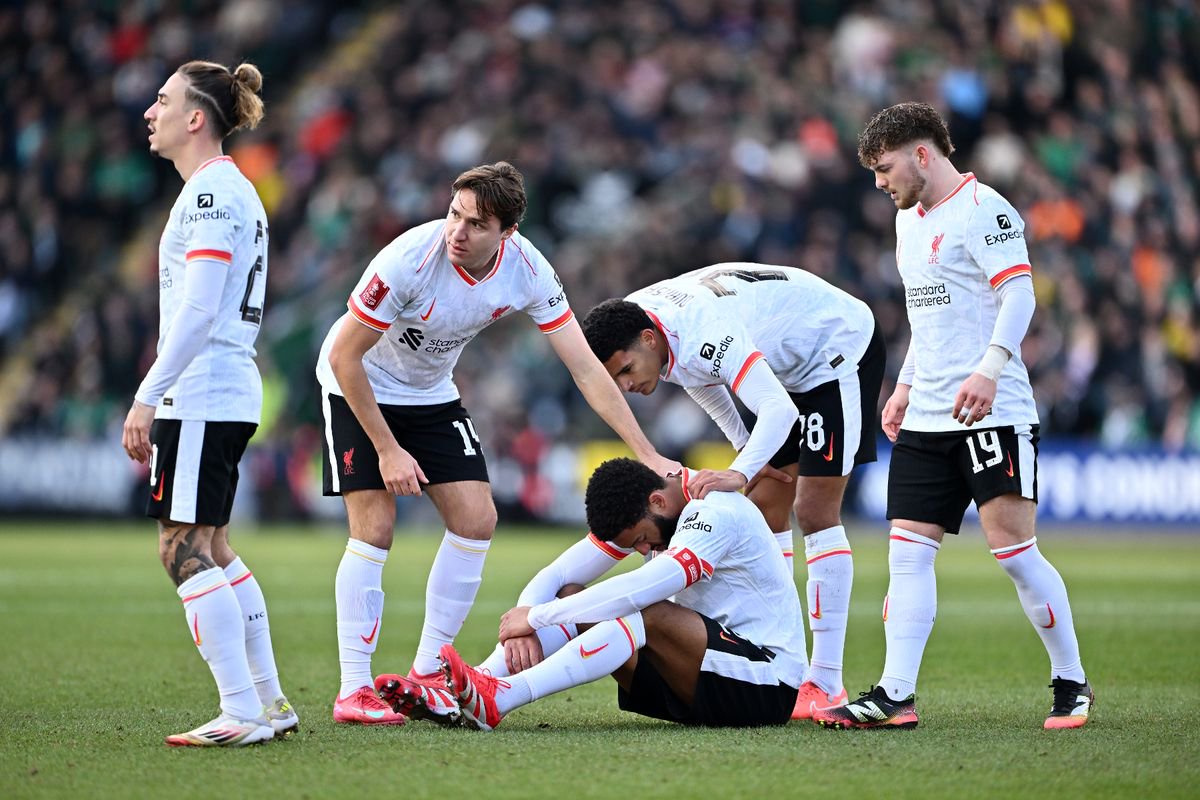 Joe Gomez of Liverpool reacts on the floor as Kostas Tsimikas, Federico Chiesa, Jarell Quansah of Liverpool and Harvey Elliott of Liverpool looks on during the Emirates FA Cup Fourth Round match between Plymouth Argyle and Liverpool