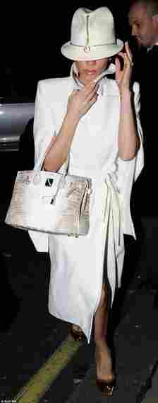 Renowned fashionista Victoria Beckham completes a chic outfit with a Birkin bag in 2010