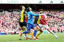 Dominic Solanke fouls Arsenal goalkeeper David Raya