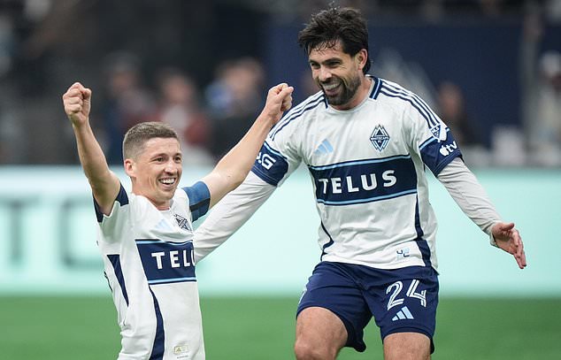 Vancouver Whitecaps' Ryan Gauld, left, and Brian White celebrate Gauld's goal during the second half of an MLS soccer match against San Diego FC, in Vancouver, British Columbia, Wednesday, Oct. 28, 2026. (Darryl Dyck/The Canadian Press via AP)