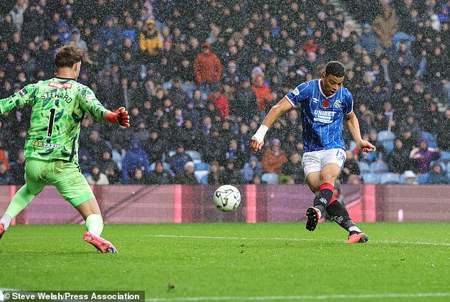 Kevin Kelsy beats Toby Stewart to open the scoring for Rangers against St Johnstone