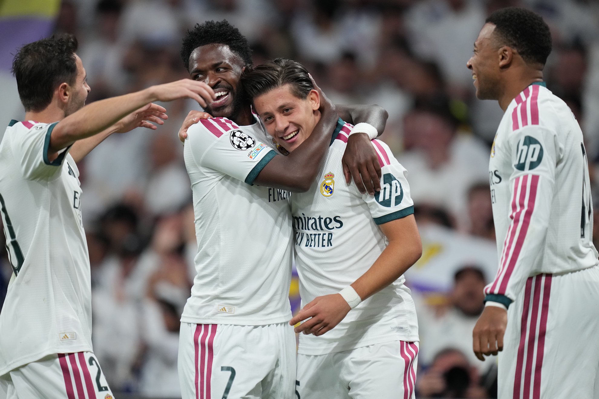Real Madrid's Arda Guler, center right, celebrates after scoring.