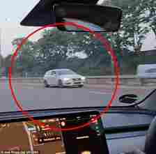 The Audi can be seen driving in the opposite direction in the fast lane of the motorway.