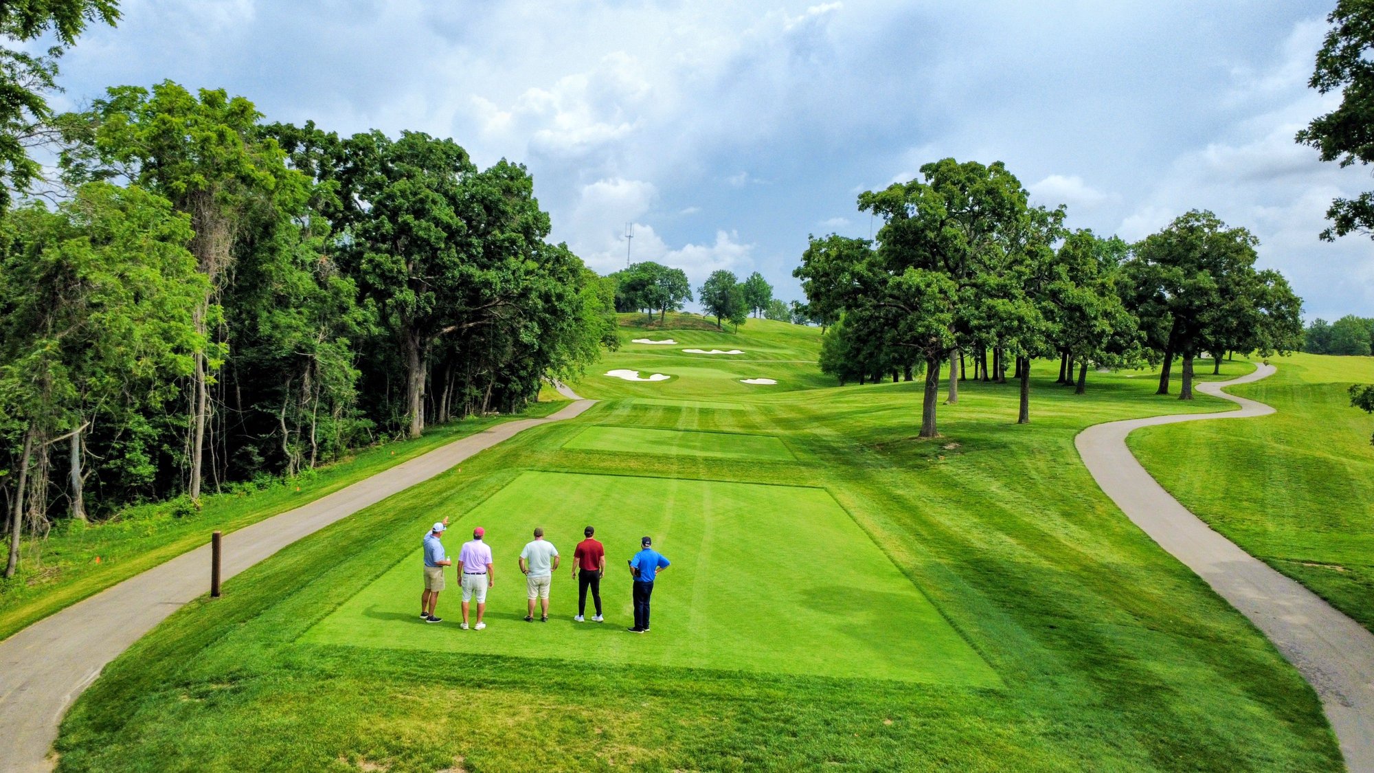 Architect Todd Clark, left, shows off a par-3 at Swope Memorial in Kansas City.