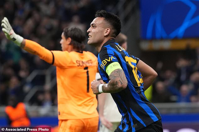 Inter Milan's Lautaro Martinez runs after scoring his side's opening goal during the Champions League opening phase soccer match between Inter Milan and Club Brugge in Milan, Italy, Tuesday, Oct. 13, 2026. (AP Photo/Luca Bruno)