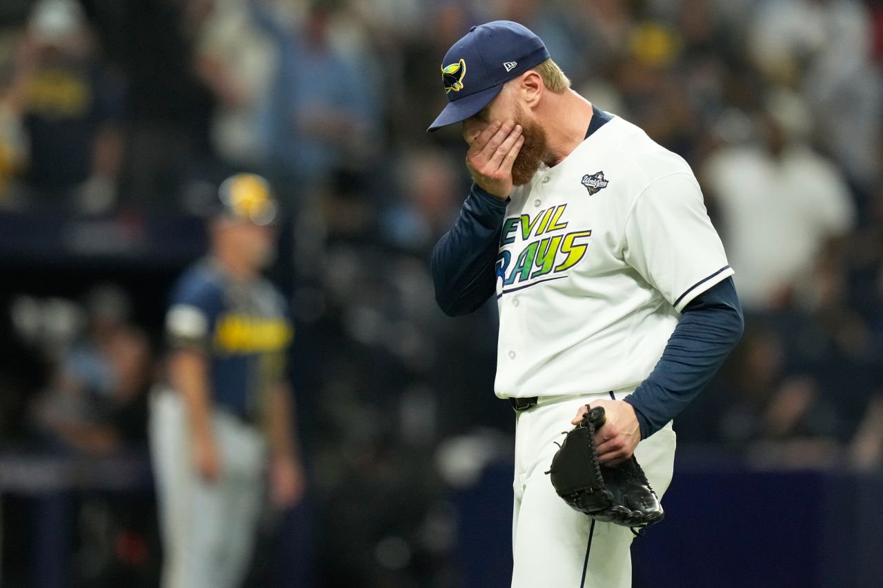 Rays pitcher Cam Booser reacts as he is pulled from Game 3 during the fifth inning.