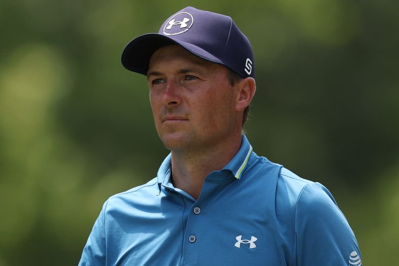Jordan Spieth looks on