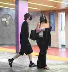 Kylie Jenner and Timothée Chalamet walking in a parking lot together