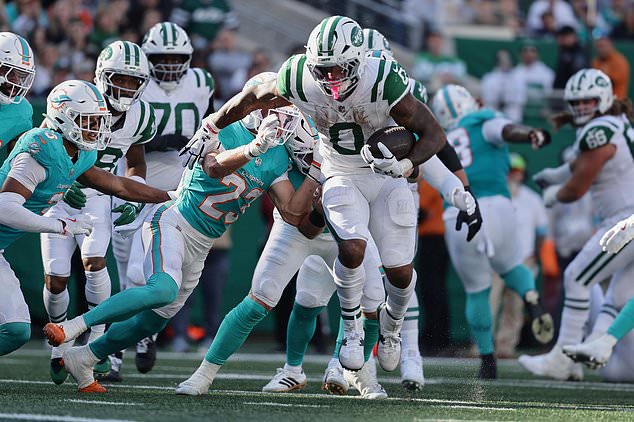New York Jets running back Braelon Allen (0) carries against the Miami Dolphins in the second half of an NFL football game in East Rutherford, N.J., Sunday, Oct. 25, 2026. (AP Photo/Adam Hunger)