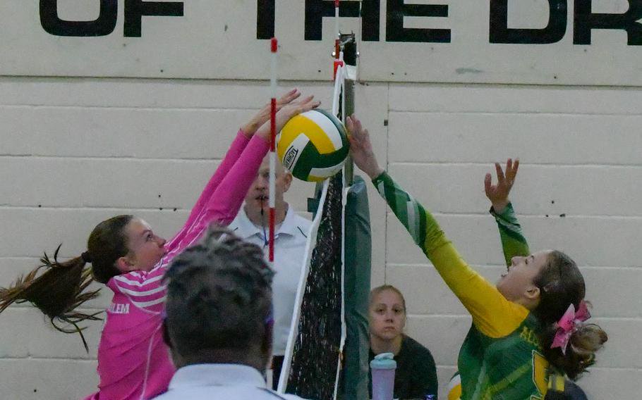 Players battle at the net.