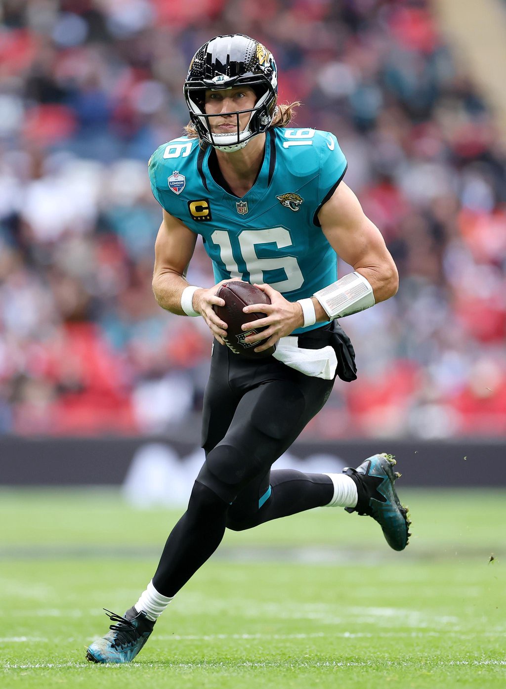 Trevor Lawrence of the Jacksonville Jaguars runs with the ball during the NFL London Series match between the Houston Texans and the Jacksonville Jaguars at Wembley Stadium in London on Sunday, Oct. 18, 2026.