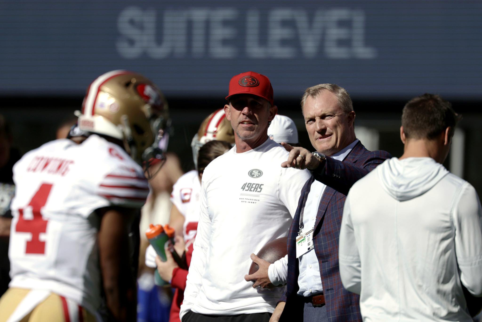San Francisco 49ers general manager John Lynch chats with head coach Kyle Shanahan on the sideline before a game.