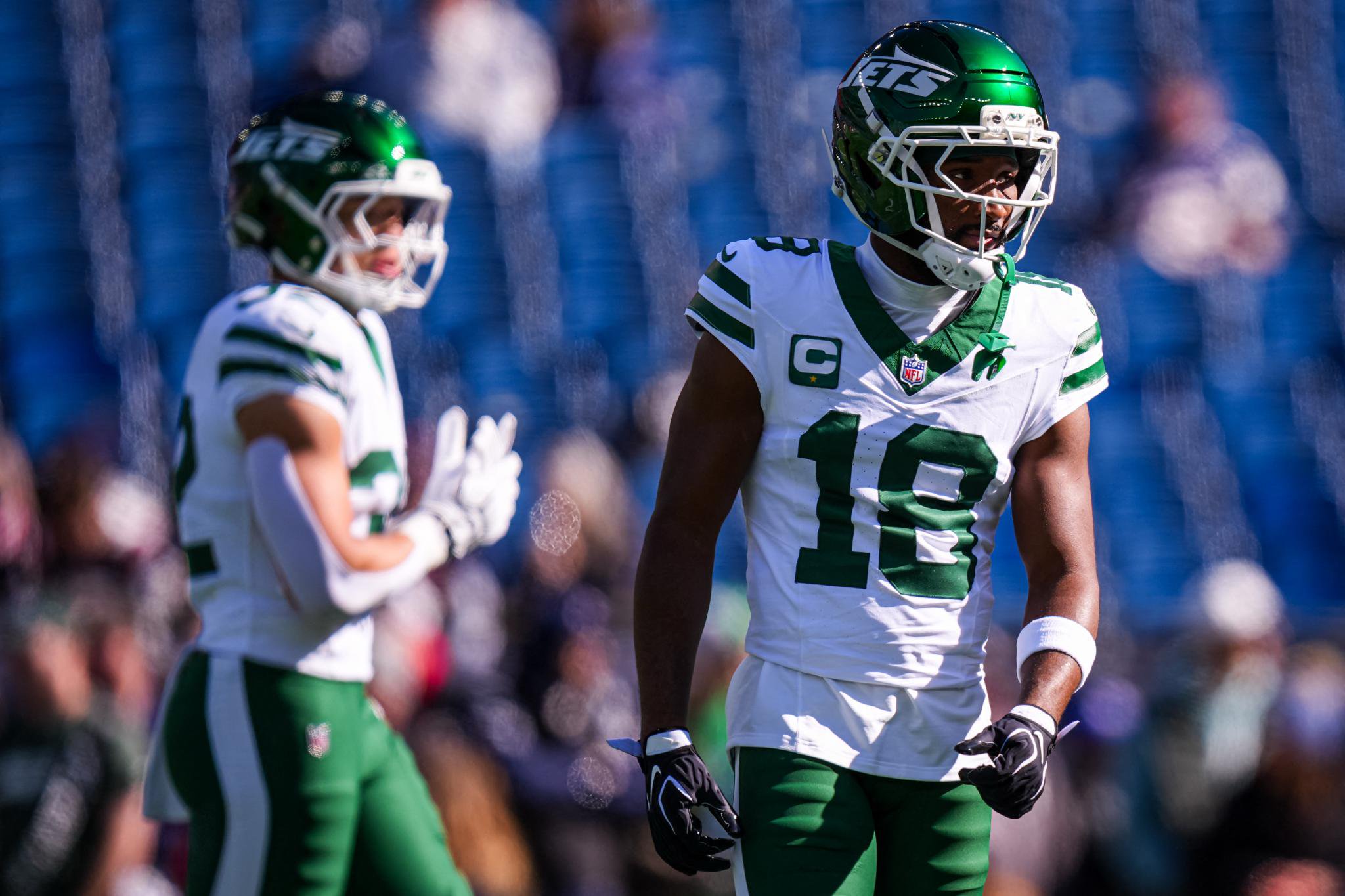 New York Jets wide receiver Isaiah Williams and running back Kene Nwangwu warm up before a game.
