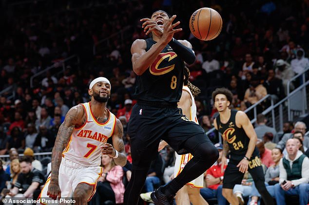 Cleveland Cavaliers guard Peyton Watson (8) loses the ball out of bounds against Atlanta Hawks guard Nickeil Alexander-Walker (7) during the first half of an NBA basketball game, Thursday, Oct. 29, 2026, in Atlanta. (AP Photo/Erik S. Lesser)