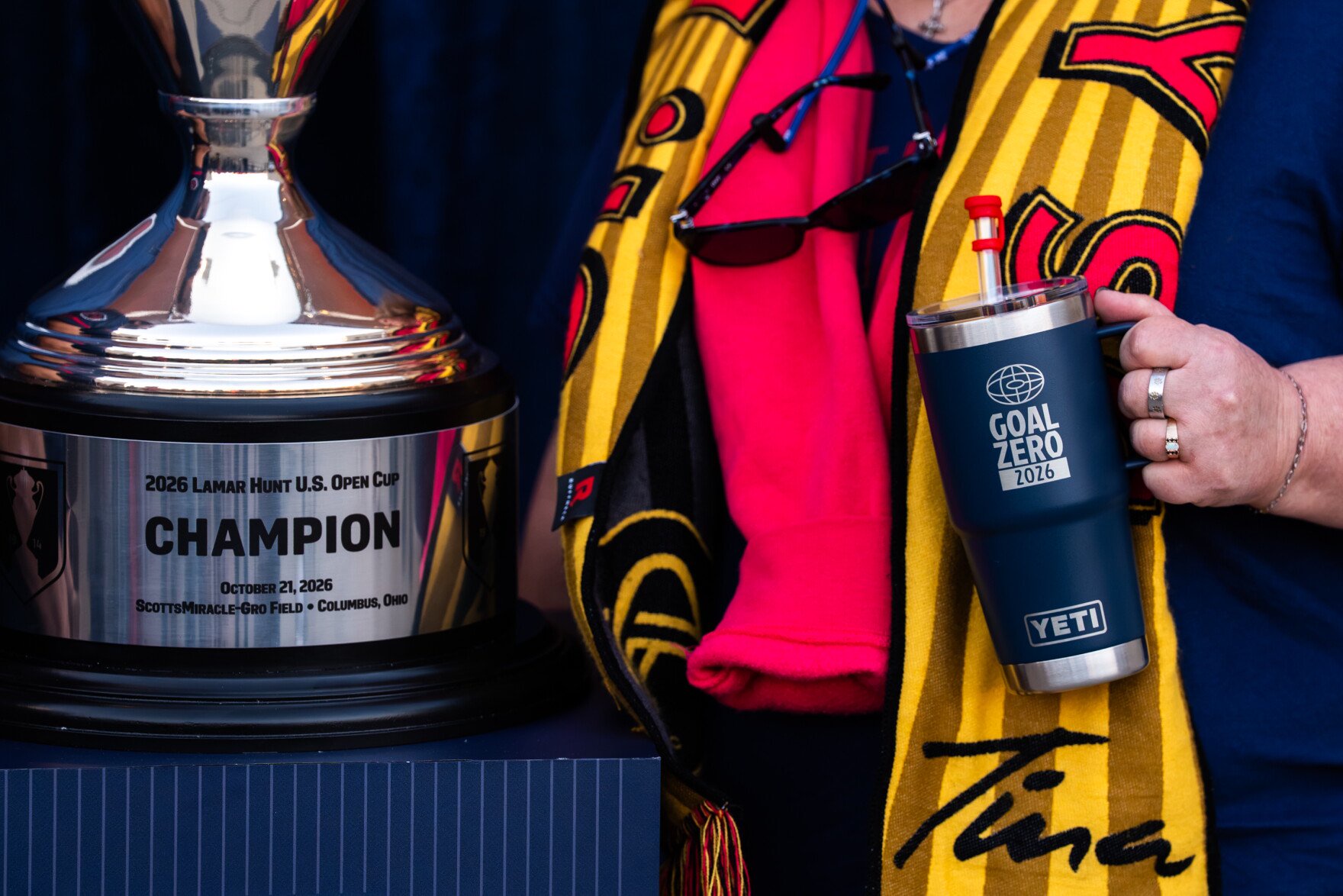 St. Louis City SC fans pose alongside the Lamar Hunt U.S. Open Cup outside of Energizer Park on Wednesday, Oct. 28, 2026, in St. Louis’ Downtown West neighborhood.