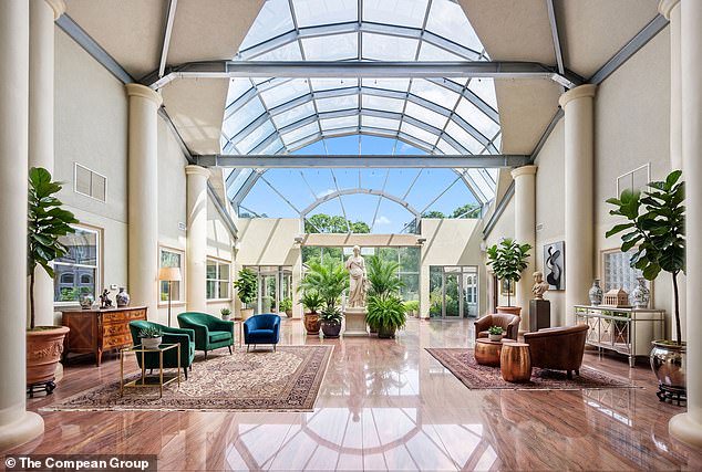 Epic: The real showstopper is the enormous glass atrium at the center of the house