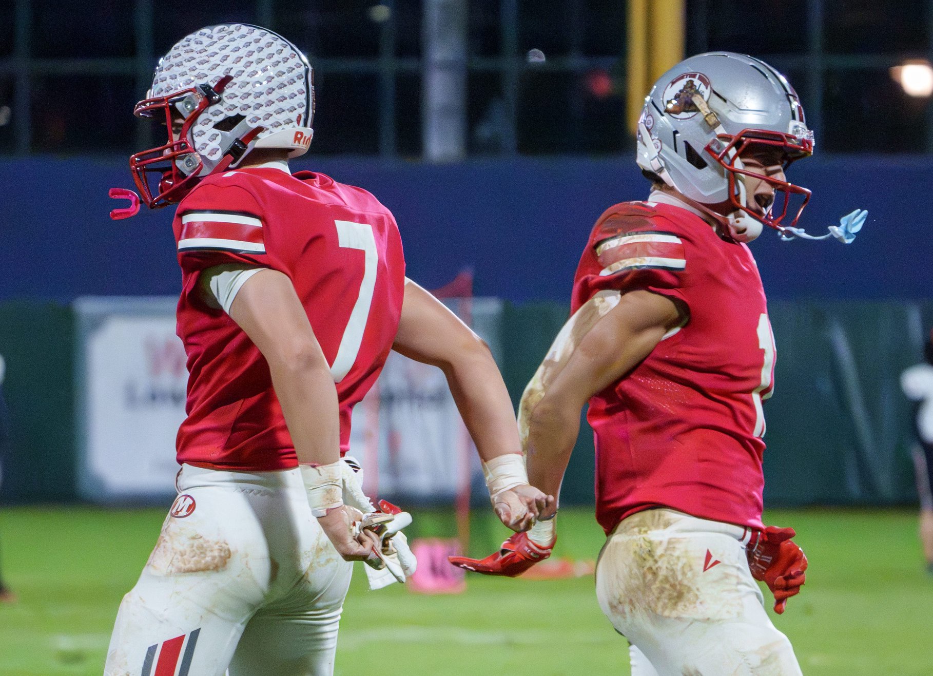 Morton teammates Brody Fritz, left, and Brody Pinter celebrate as time runs out in their 35-7 victory over Metamora in their Week 9 high school football game Friday, Oct. 16, 2026 at Dozer Park in Peoria. The Potters defeated the Redbirds 35-7.