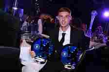 Cole Palmer of Chelsea with his two awards for Chelsea Player of the Year, and Chelsea Players' Player of the Year during the Chelsea FC 2024 Award...