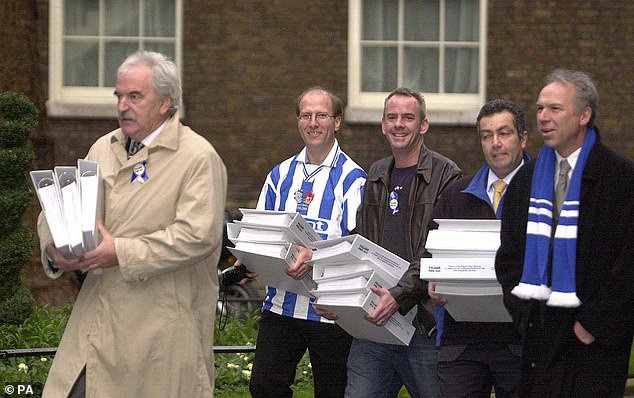 Brighton-supporting accountant Paul Samrah (second right) was influential in exposing the mismanagement of the Seagulls' former owner Bill Archer