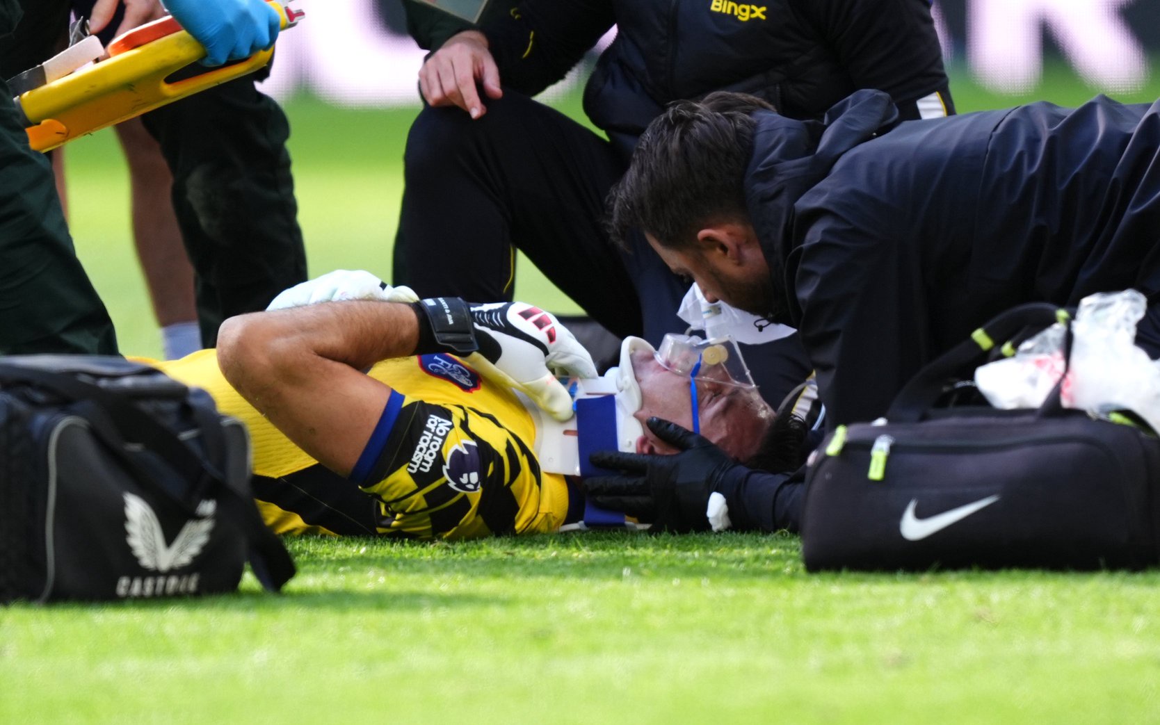 Emi Martinez receives treatment on the pitch (PA)