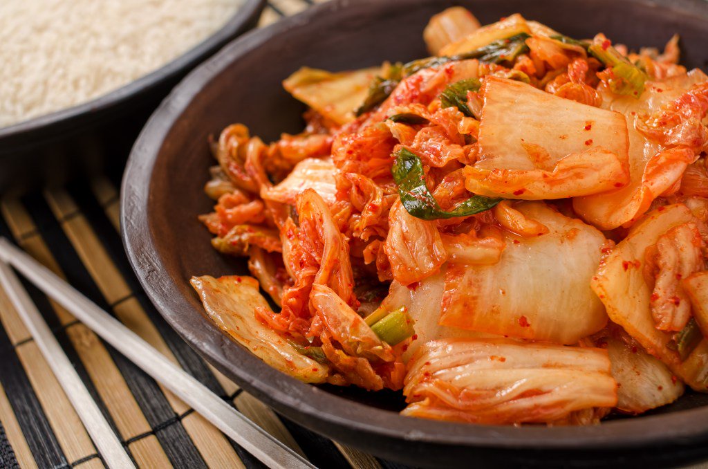 Bowl of Kimchi on a Table to support healthy digestion and obesity avoidance.