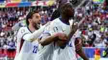 Belgian players celebrate France's late winner