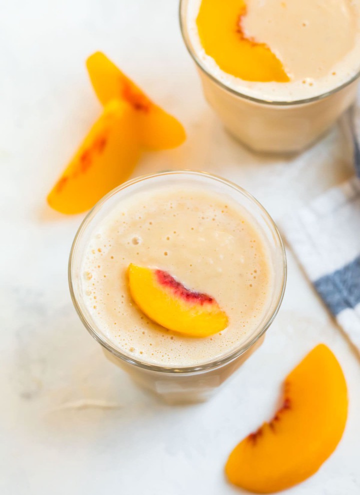 Two peach smoothies in glasses
