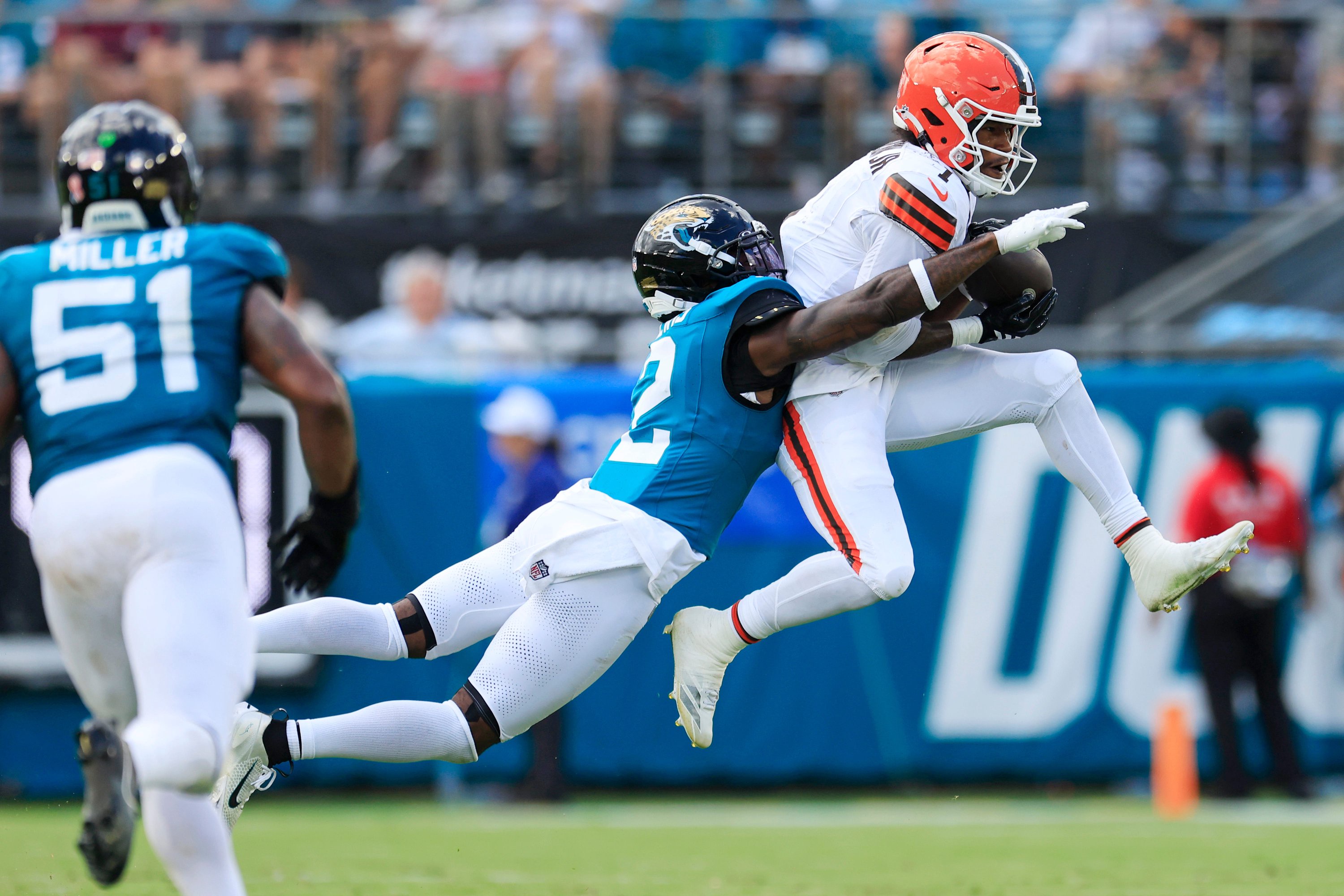 Jacksonville Jaguars cornerback Jourdan Lewis (2) pressures Cleveland Browns wide receiver KC Concepcion Jr. (1) as he makes the reception during the fourth quarter of an NFL football matchup at EverBank Stadium on Sunday, Sept. 13, 2026, in Jacksonville, Fla. The Jaguars defeated the Browns 34-10. [Corey Perrine/Florida Times-Union]