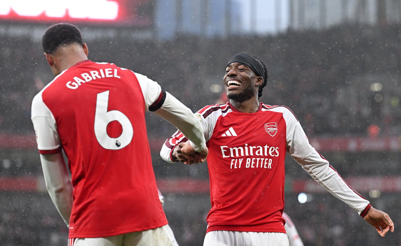 Noni Madueke celebrates with Gabriel after Arsenal went 2-0 up at home to Everton (Getty)