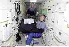 Cosmonauts on board the ISS. (NASA / Handout / via Getty)