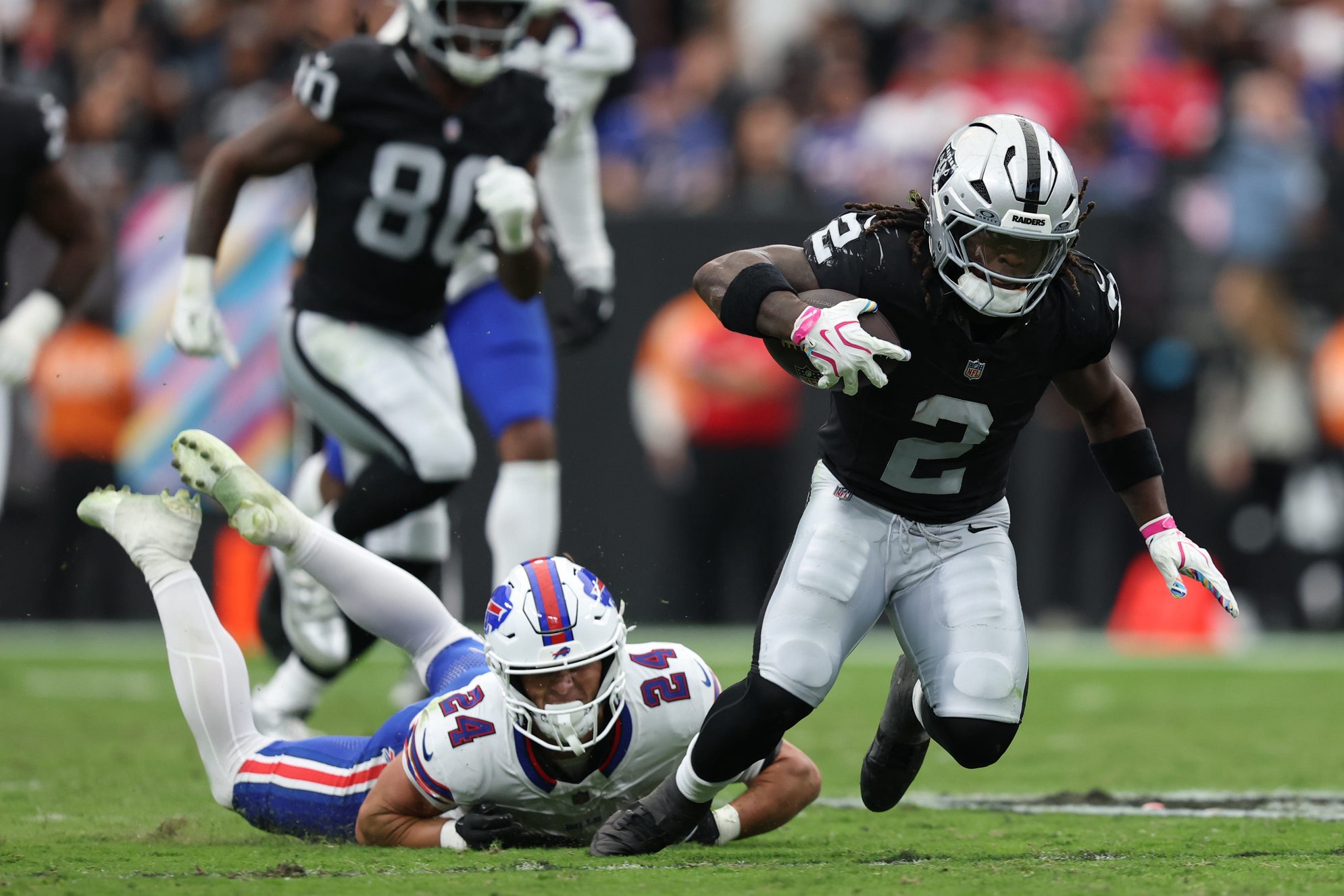 Oct 18, 2026; Paradise, Nevada, USA;  Las Vegas Raiders running back Ashton Jeanty (2) is tackled by Buffalo Bills safety Cole Bishop (24) int he second quarter at Allegiant Stadium.  Mandatory Credit: David Brytus-Imagn Images